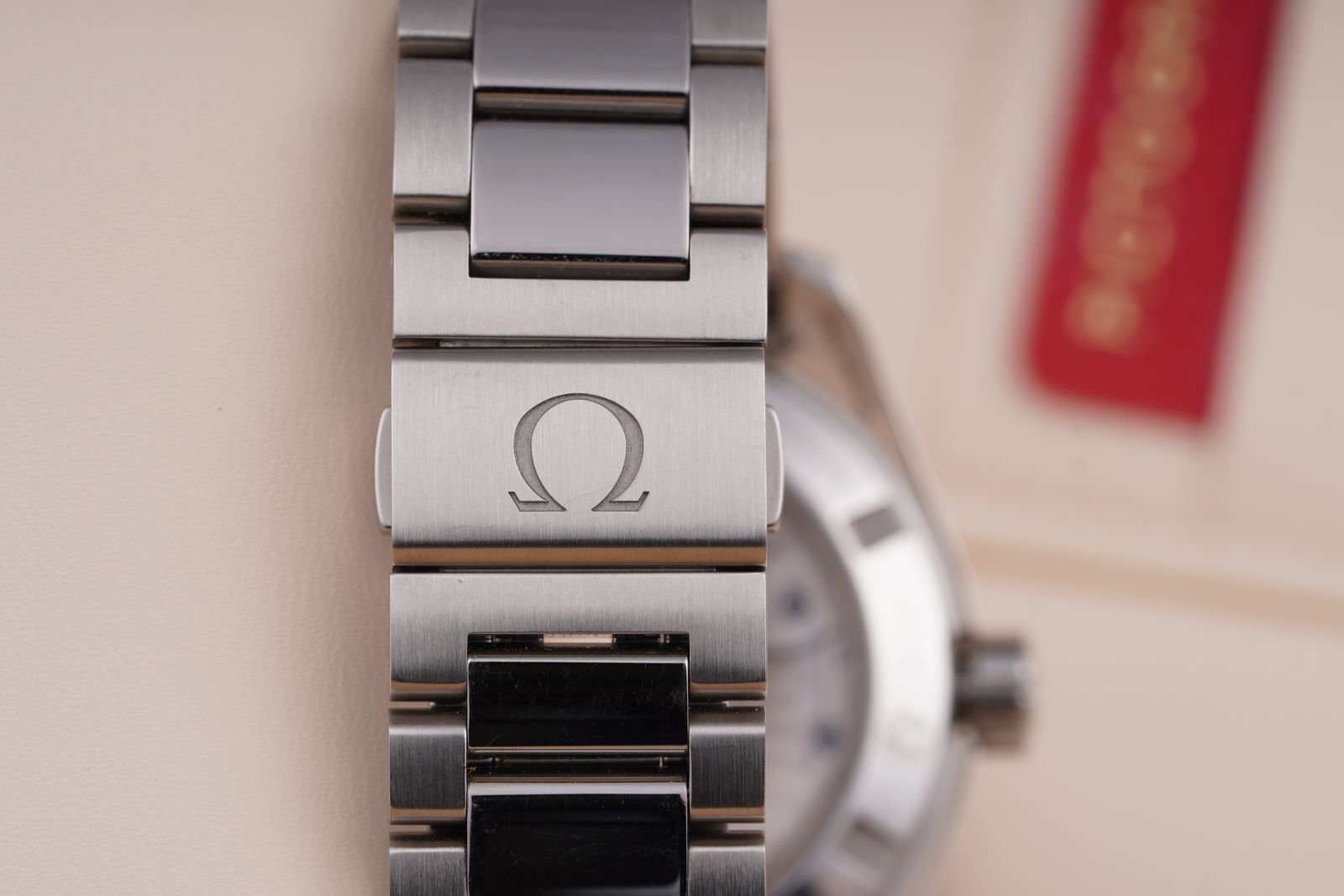 Close-up of an Omega stainless steel watch bracelet and clasp