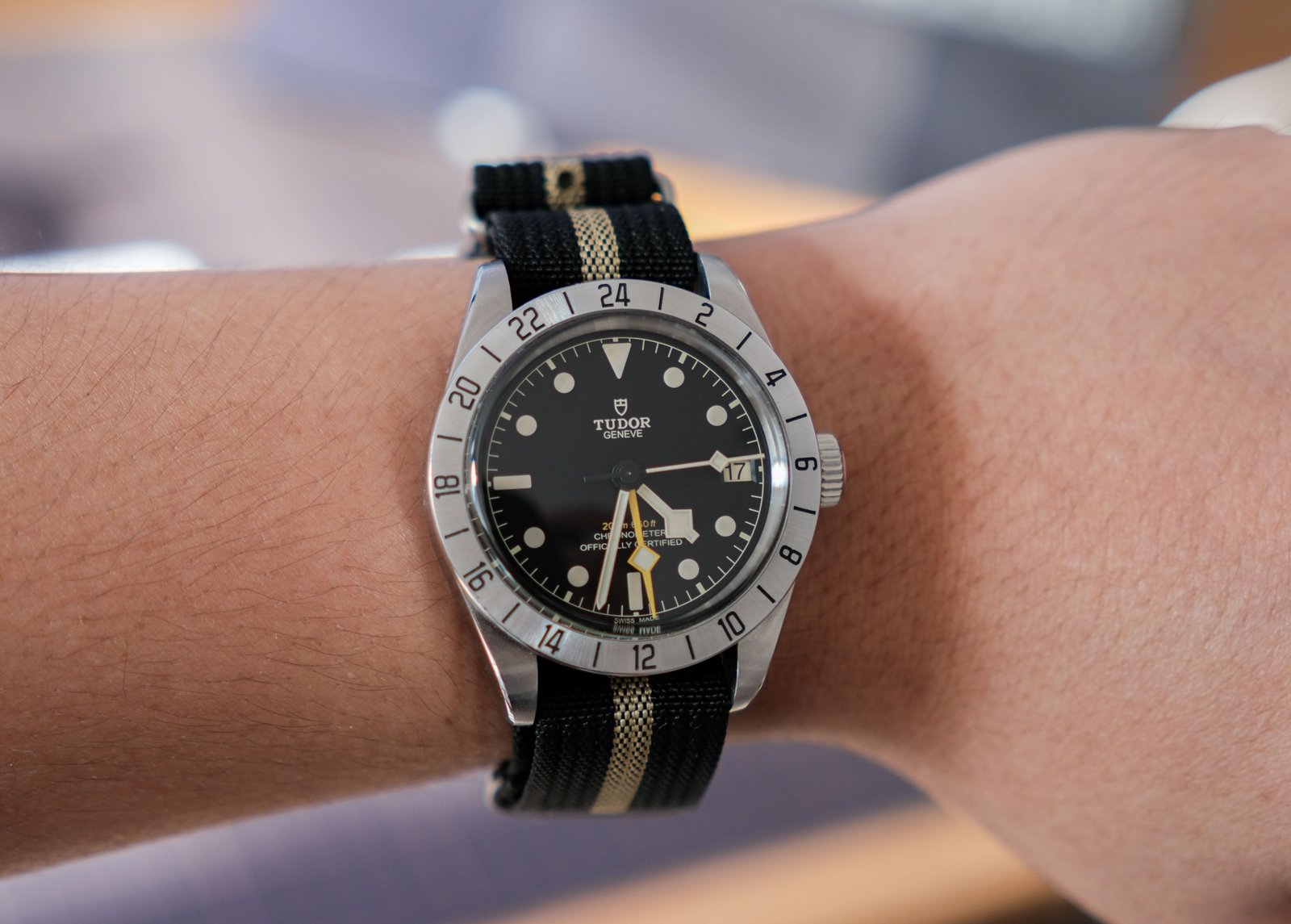 Close-up of a luxury wristwatch on the wrist in natural light