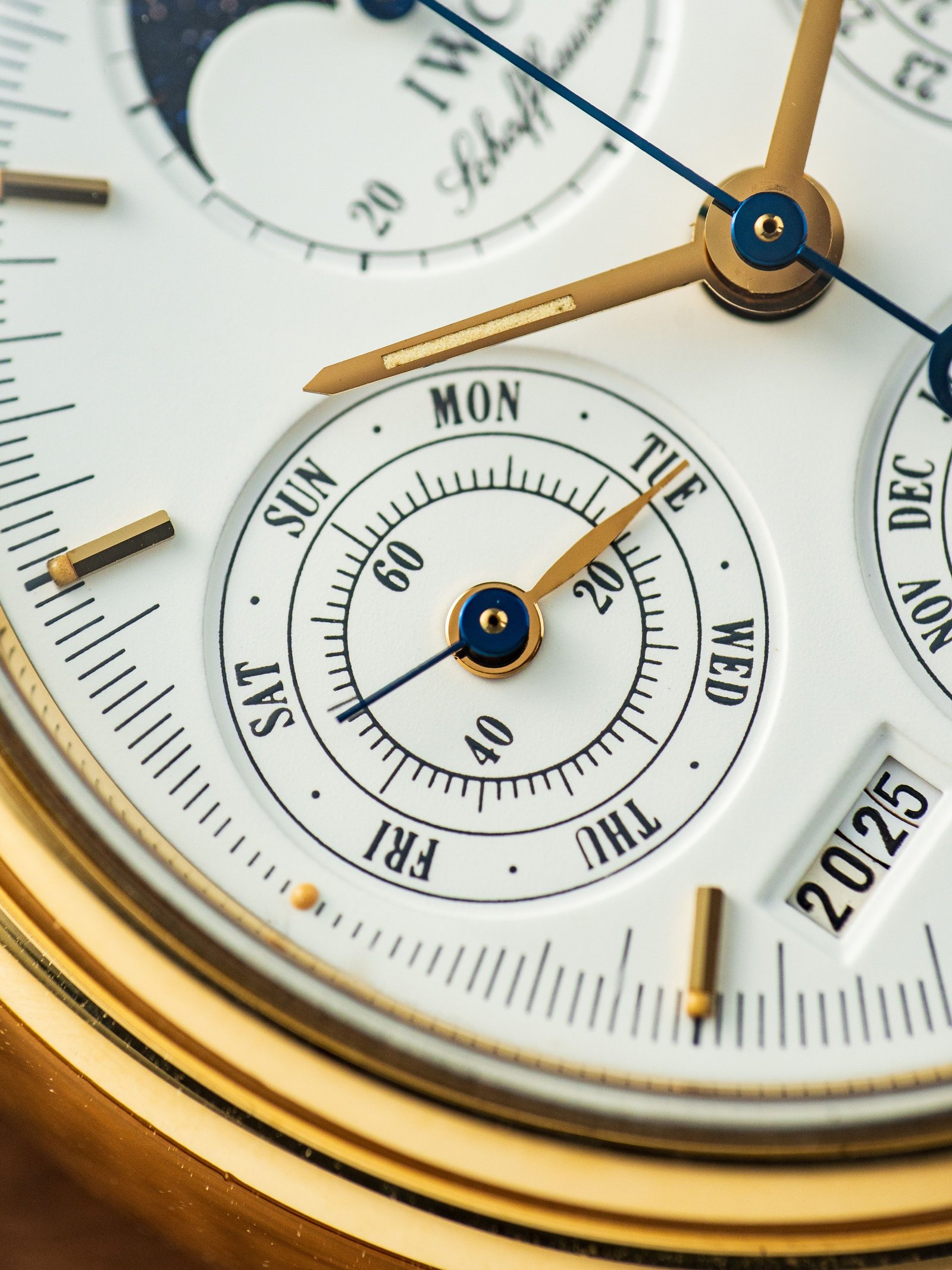 Macro detail of a luxury watch dial and hands