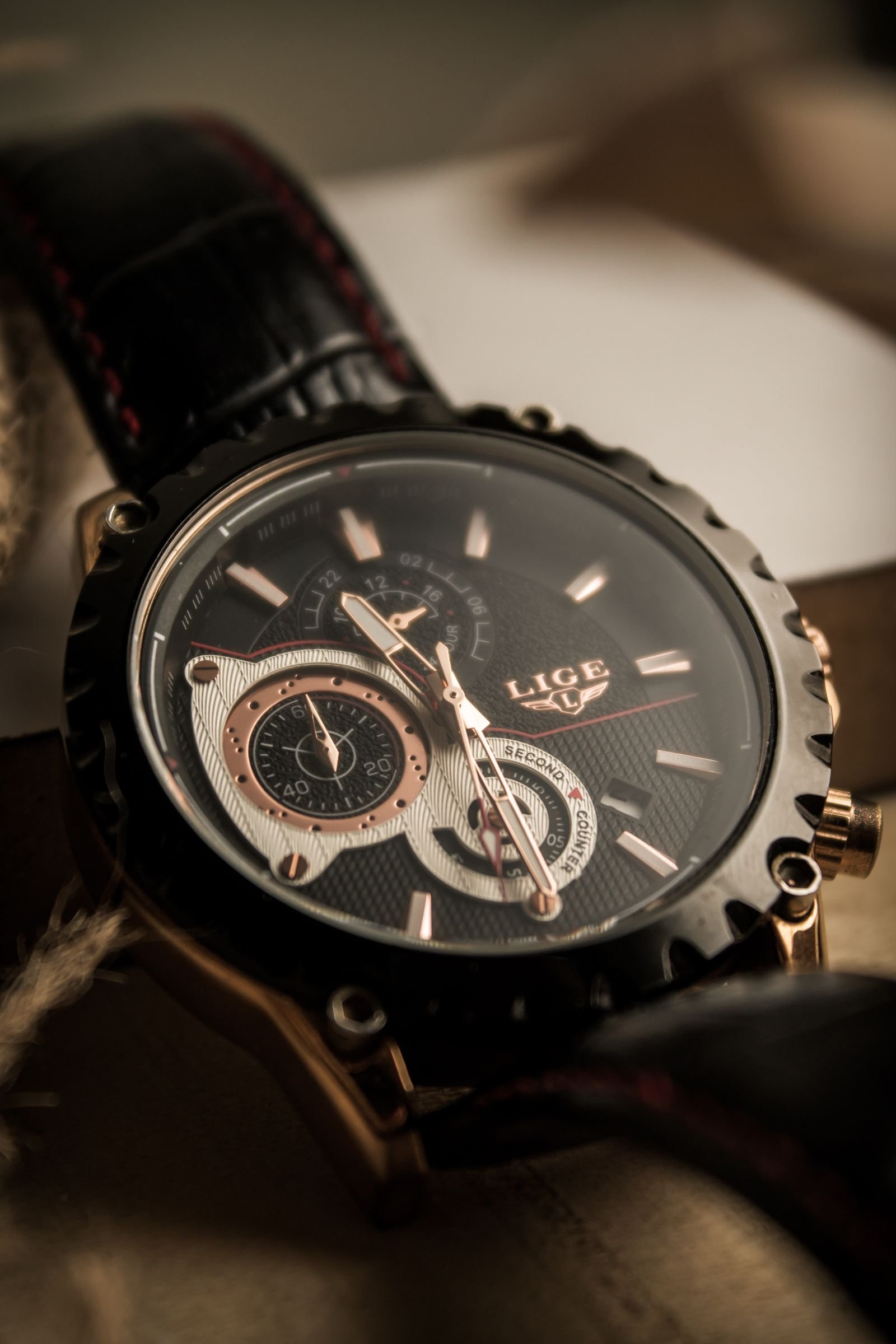 Close-up of an expensive wristwatch with a polished steel bracelet