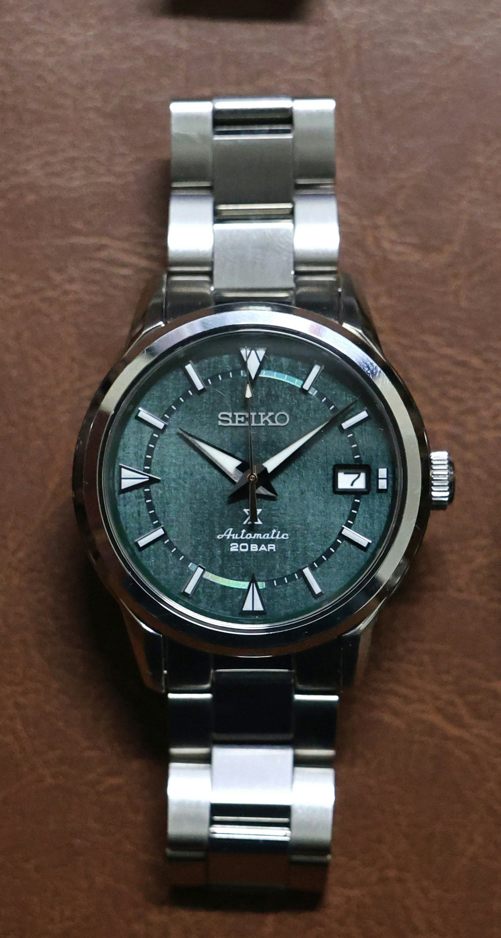 Seiko automatic watch with a green textured dial in close-up