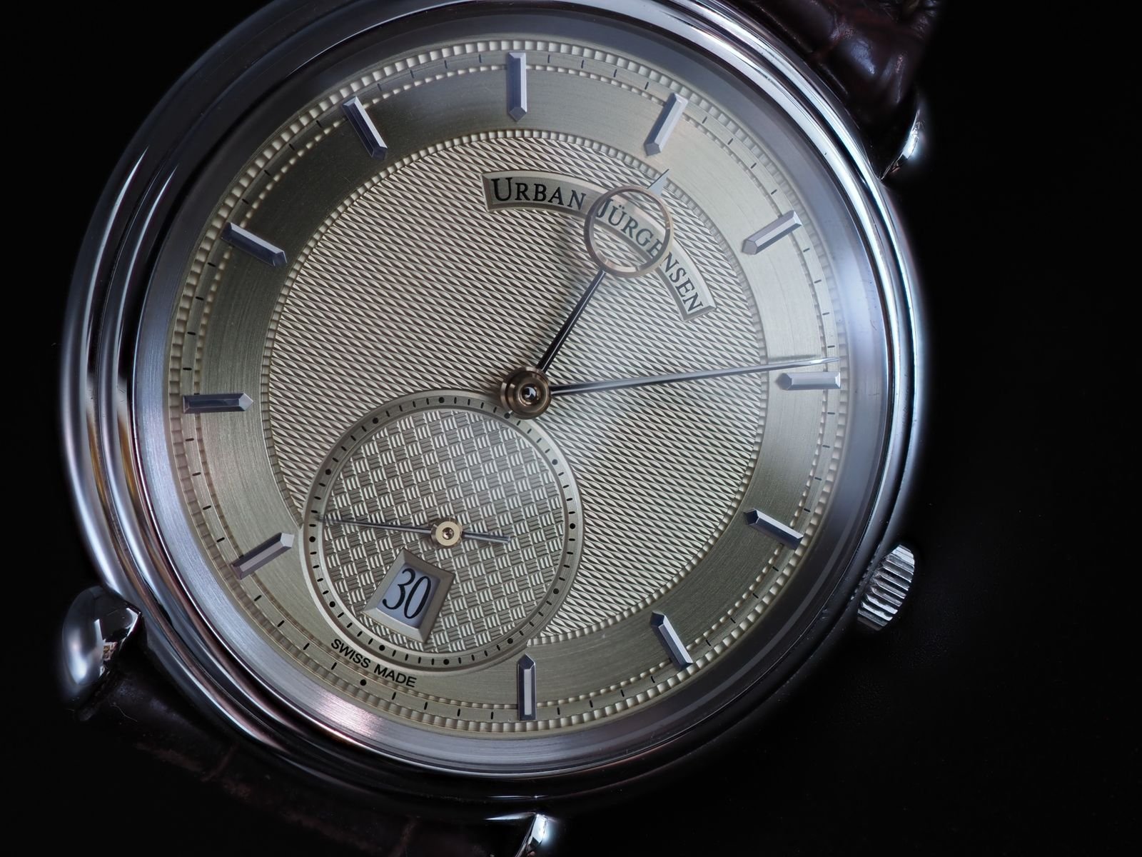 Mechanical wristwatch resting on a table after a careful visual inspection