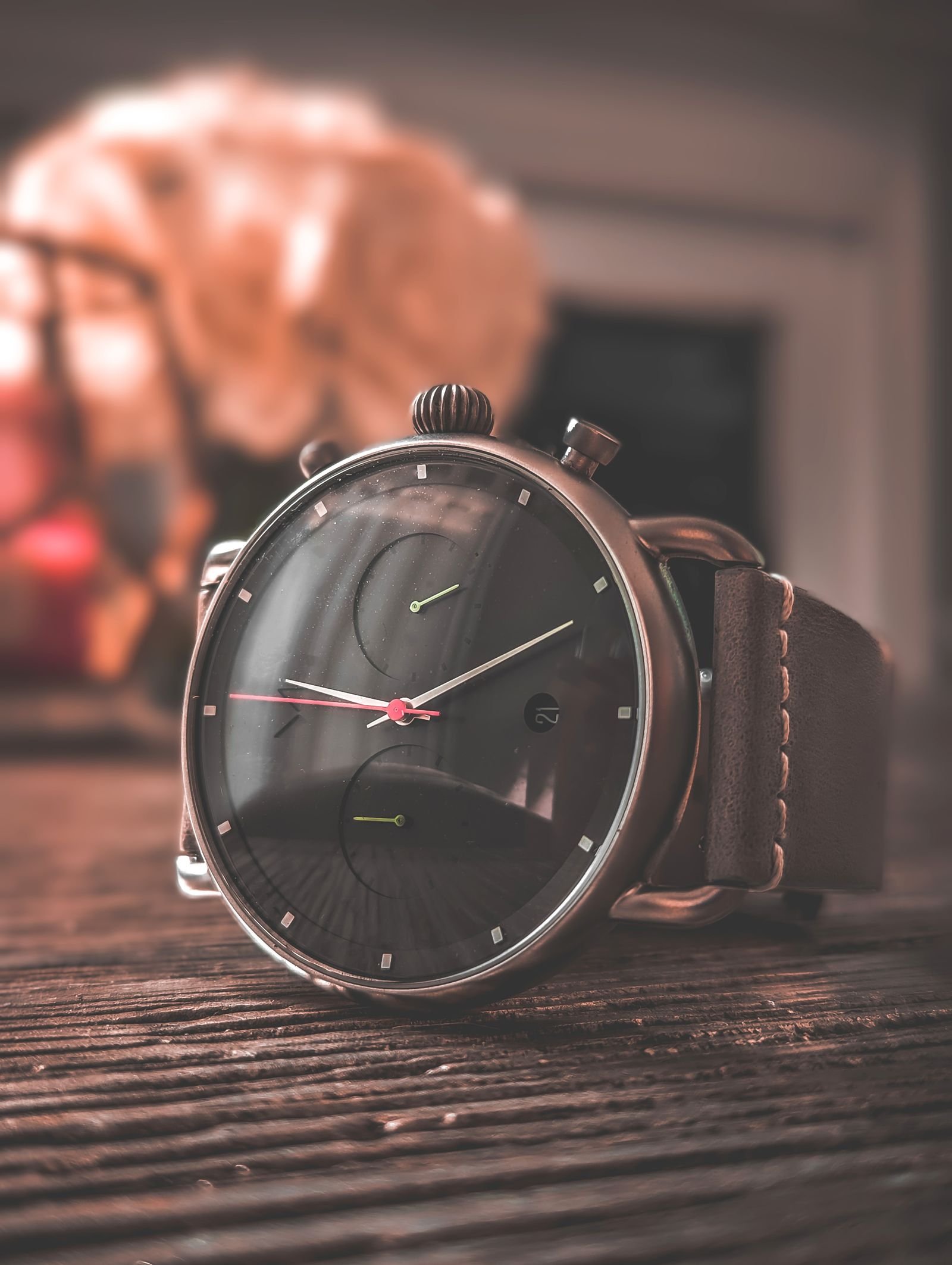 Classic wristwatch on a wooden surface for checking case and bracelet proportions