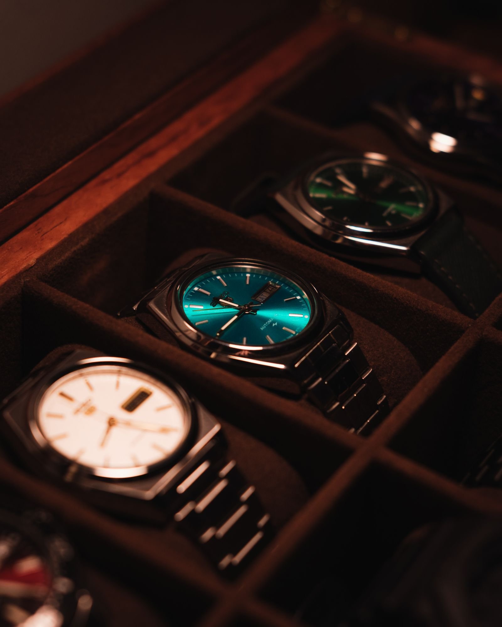Collection of automatic watches arranged in a display case