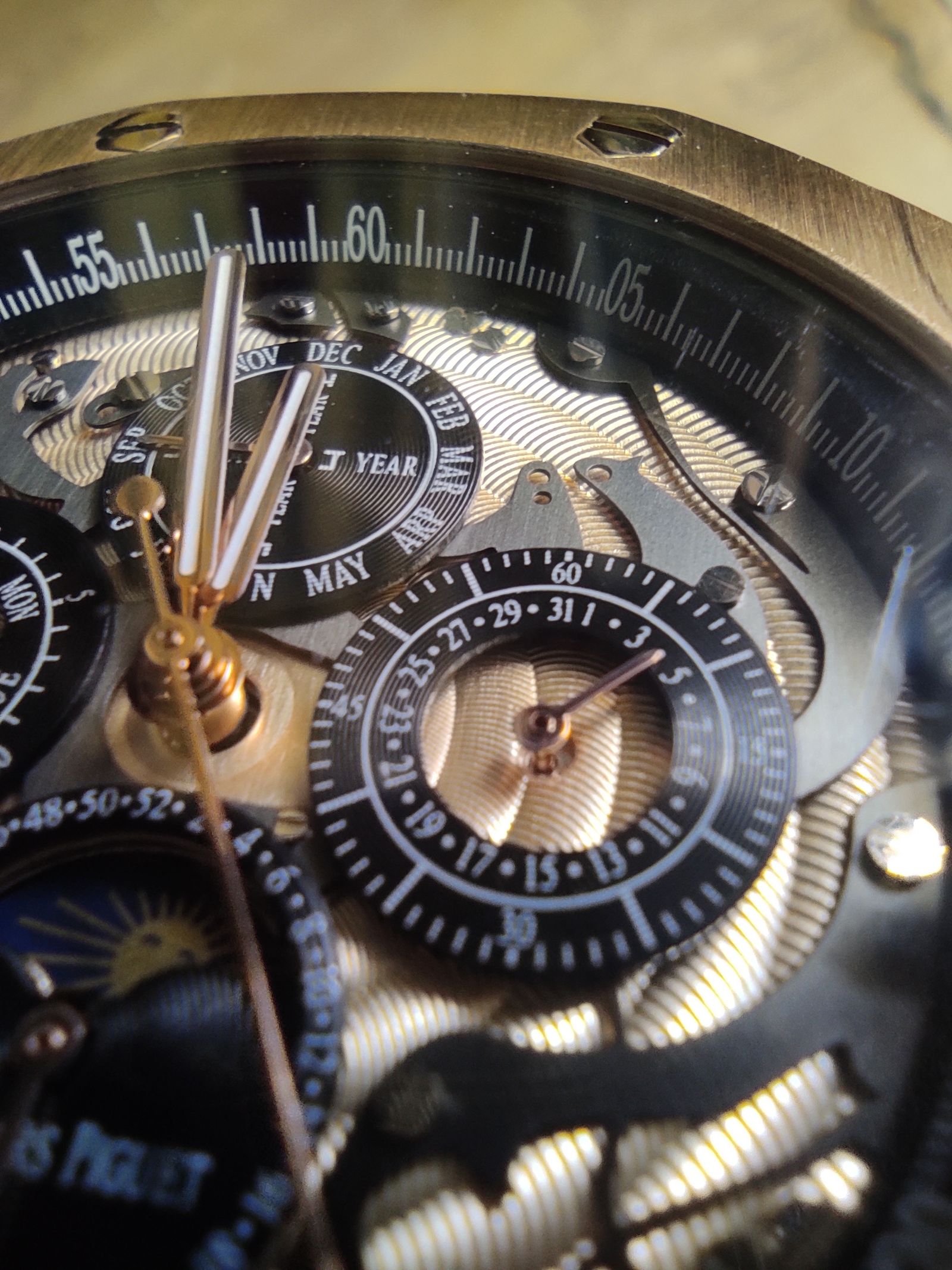 Close-up watch dial inspected for hand clearance and repeatable stopping