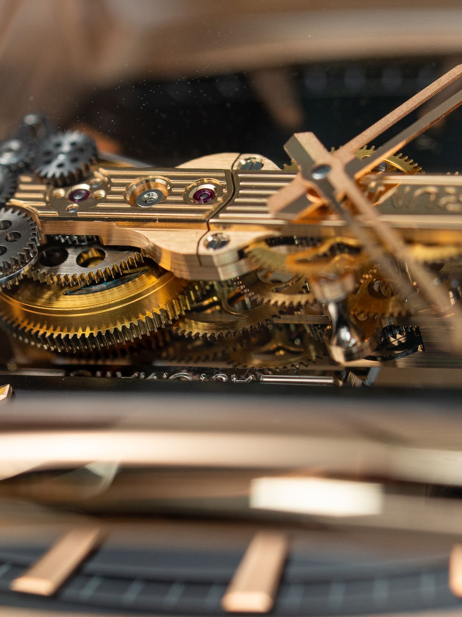 Intricate mechanical watch gears illustrating Grand Seiko Caliber 9SA5 engineering