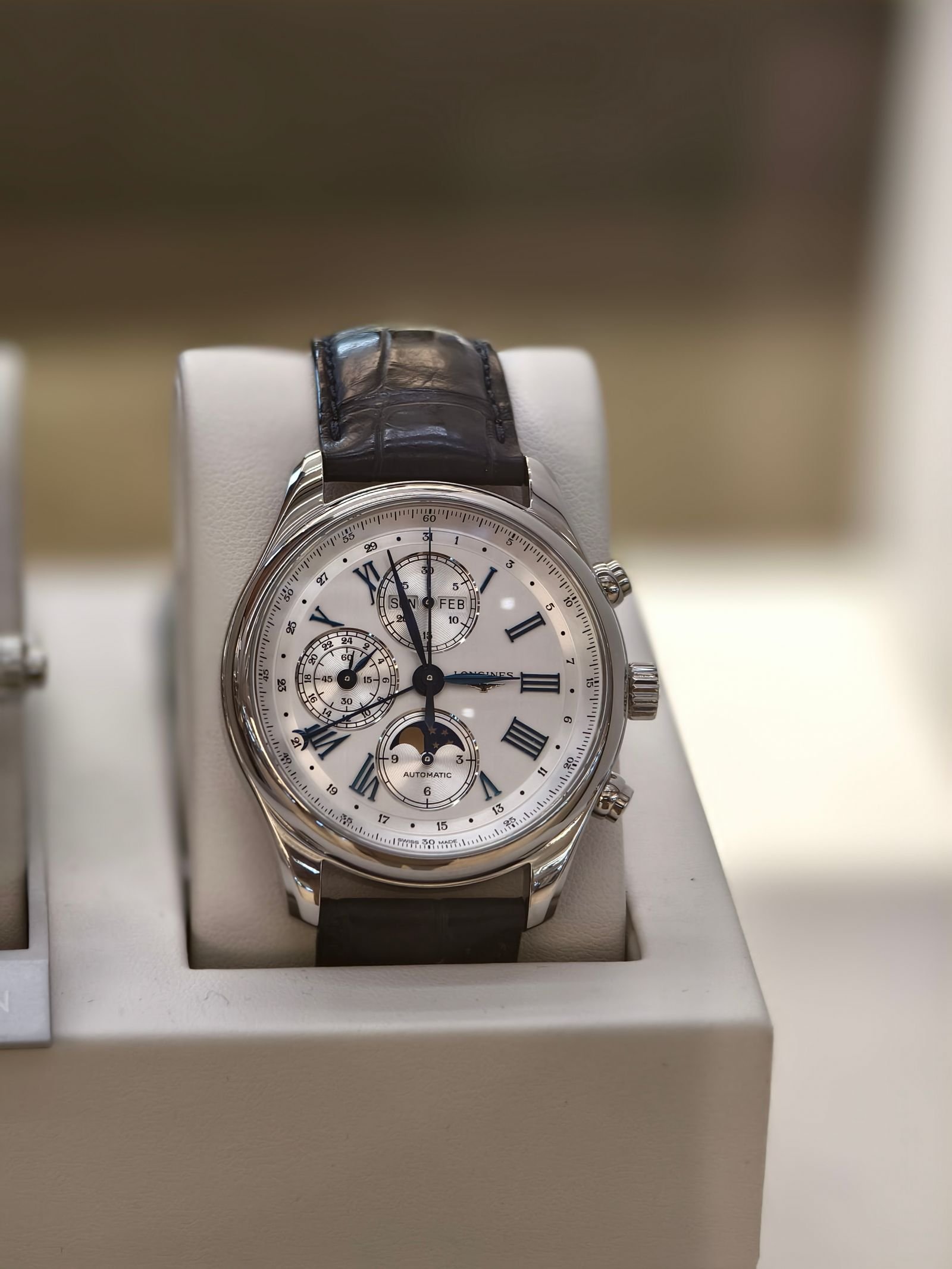 Luxury chronograph representing a Rolex Caliber 4130 watch winder setup