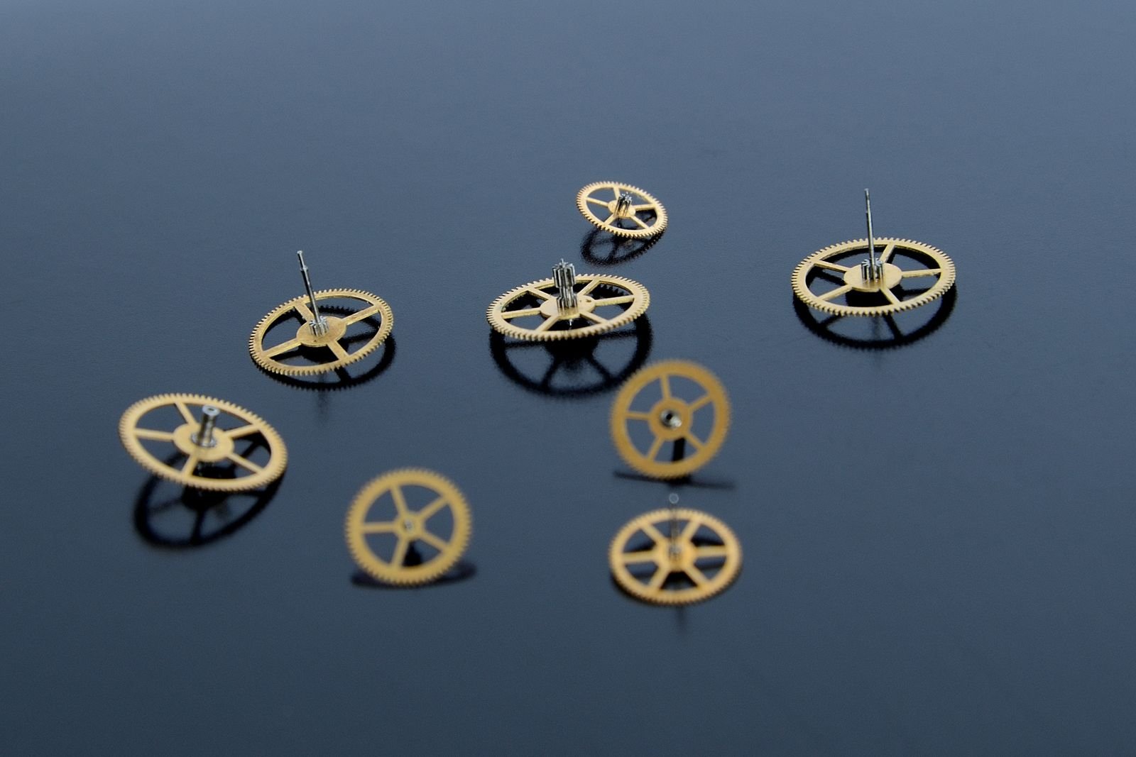 Precision gears representing the automatic winding train inside a mechanical watch