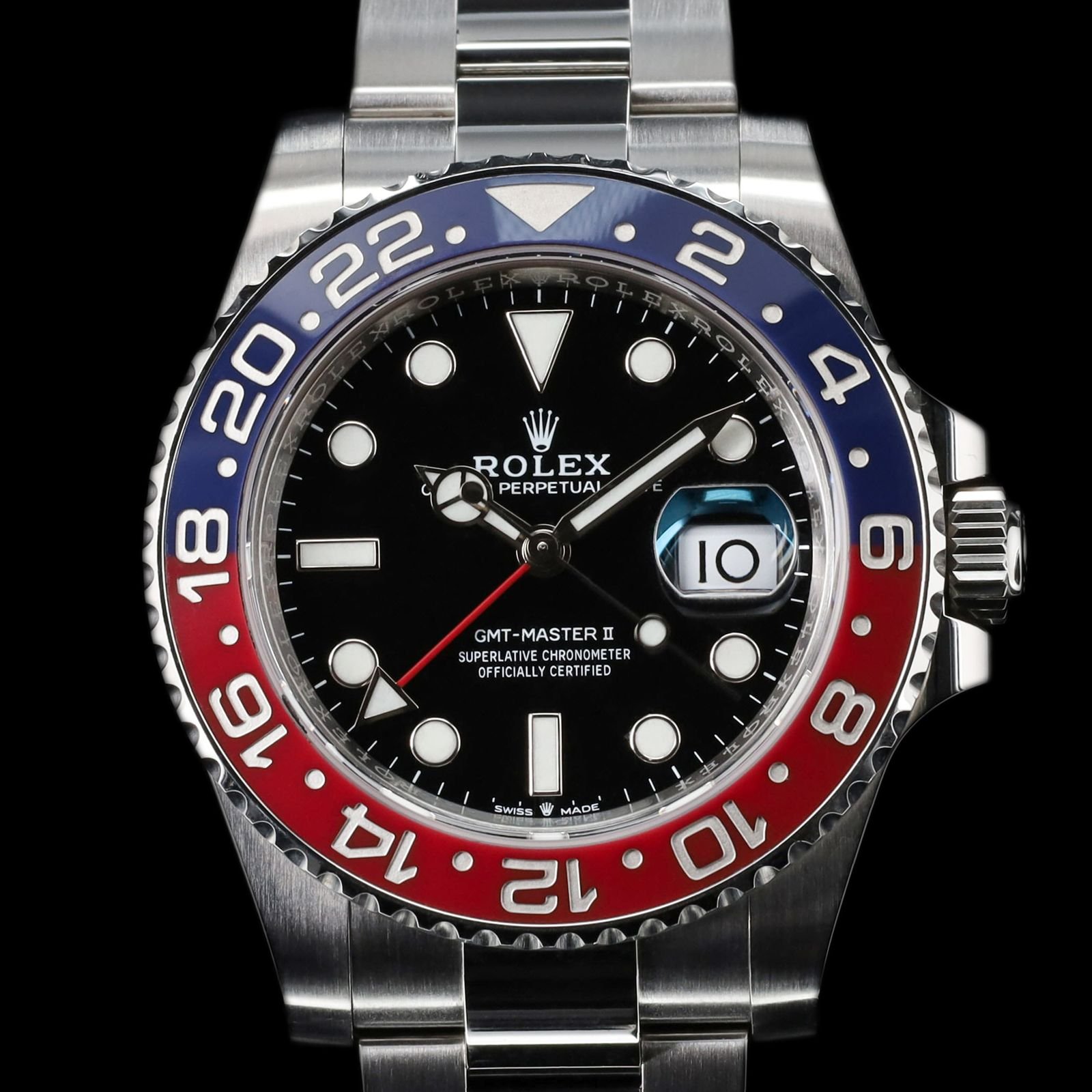 Ceramic vs aluminum watch bezels shown on a modern GMT-style sports watch